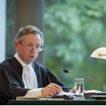 The Registrar of the ICJ, Mr Philippe Couvreur, during the Judgment session on the question of compensation in the case concerning Ahmadou Sadio Diallo (Republic of Guinea v. Democratic Republic of the Congo). This session took place, exceptionally, in the Auditorium of The Hague Academy of International Law. The ICJ's role is to settle, in accordance with international law, legal disputes submitted to it by States (its Judgments are final and binding) and to give advisory opinions on legal questions referred to it by authorized UN organs and agencies.