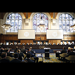 The Members of the Court on the opening day of the hearings.